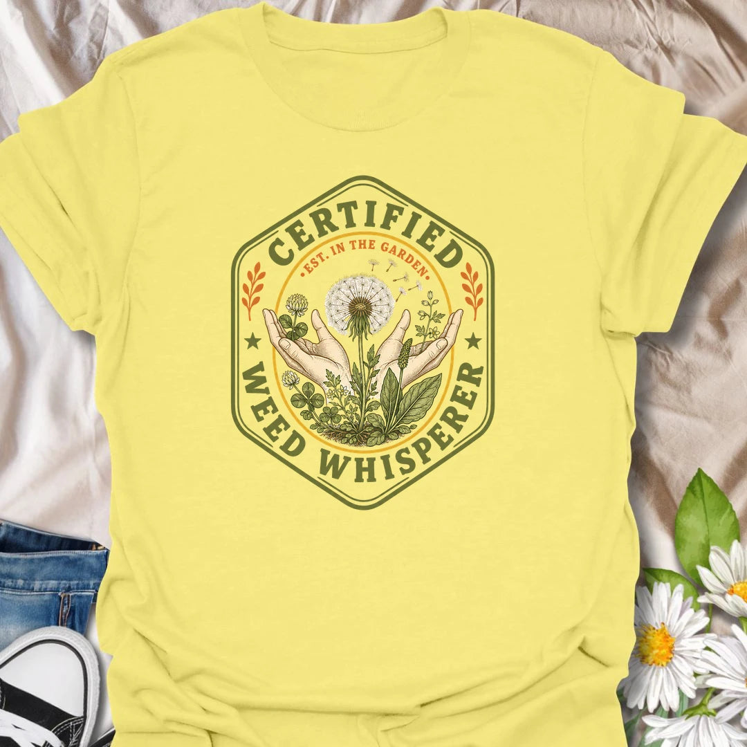 This Certified Weed Whisperer t-shirt is made for gardeners who somehow have a special talent for growing weeds whether they meant to or not. Featuring a vintage badge-style design with hands, dandelions, leafy weeds, garden details, and bold certified lettering, this tee has a funny plant-lover feel with classic garden-club charm. Perfect for gardeners, plant lovers, beginner gardeners, backyard growers, wildflower fans, and anyone whose weeds are thriving beautifully.