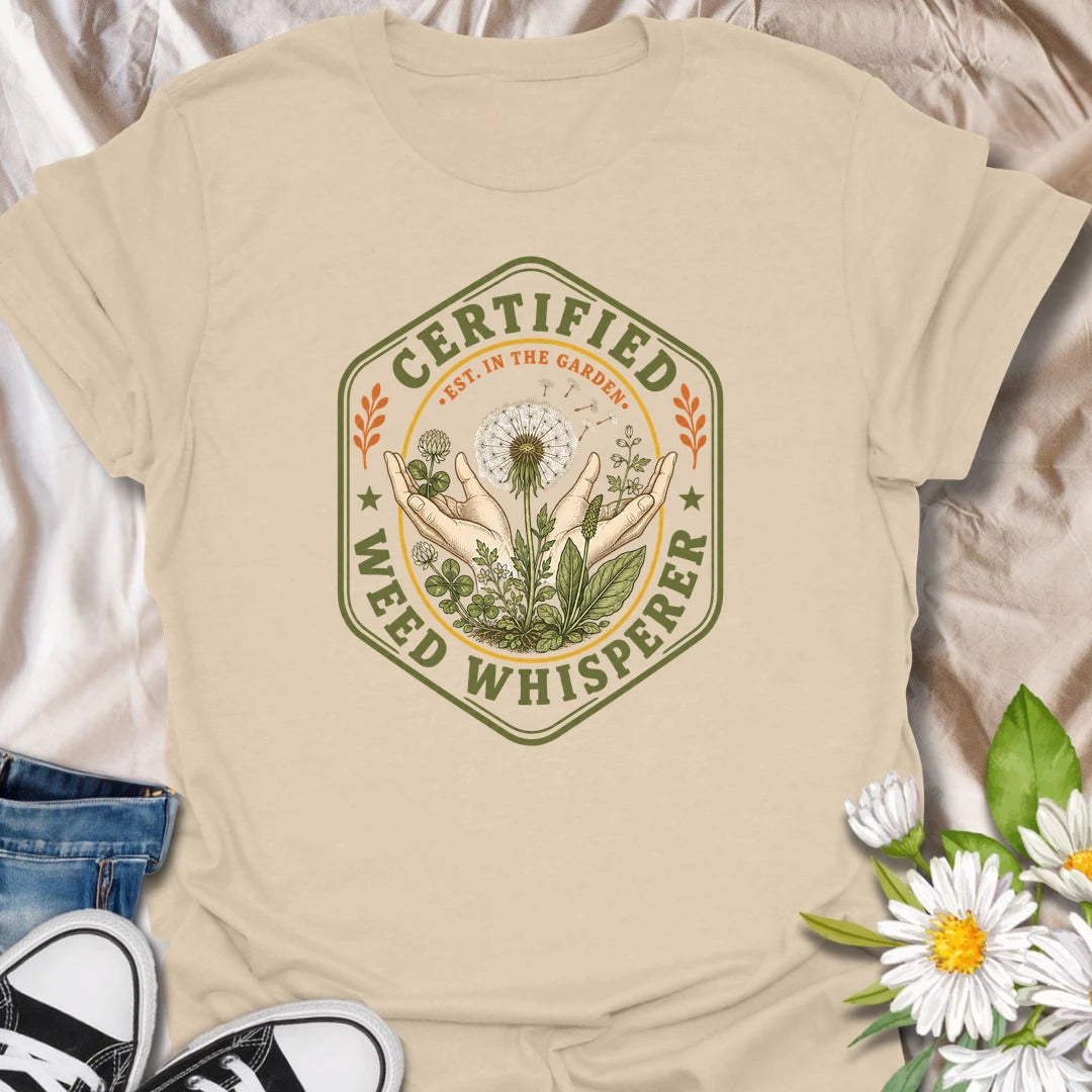 This Certified Weed Whisperer t-shirt is made for gardeners who somehow have a special talent for growing weeds whether they meant to or not. Featuring a vintage badge-style design with hands, dandelions, leafy weeds, garden details, and bold certified lettering, this tee has a funny plant-lover feel with classic garden-club charm. Perfect for gardeners, plant lovers, beginner gardeners, backyard growers, wildflower fans, and anyone whose weeds are thriving beautifully.