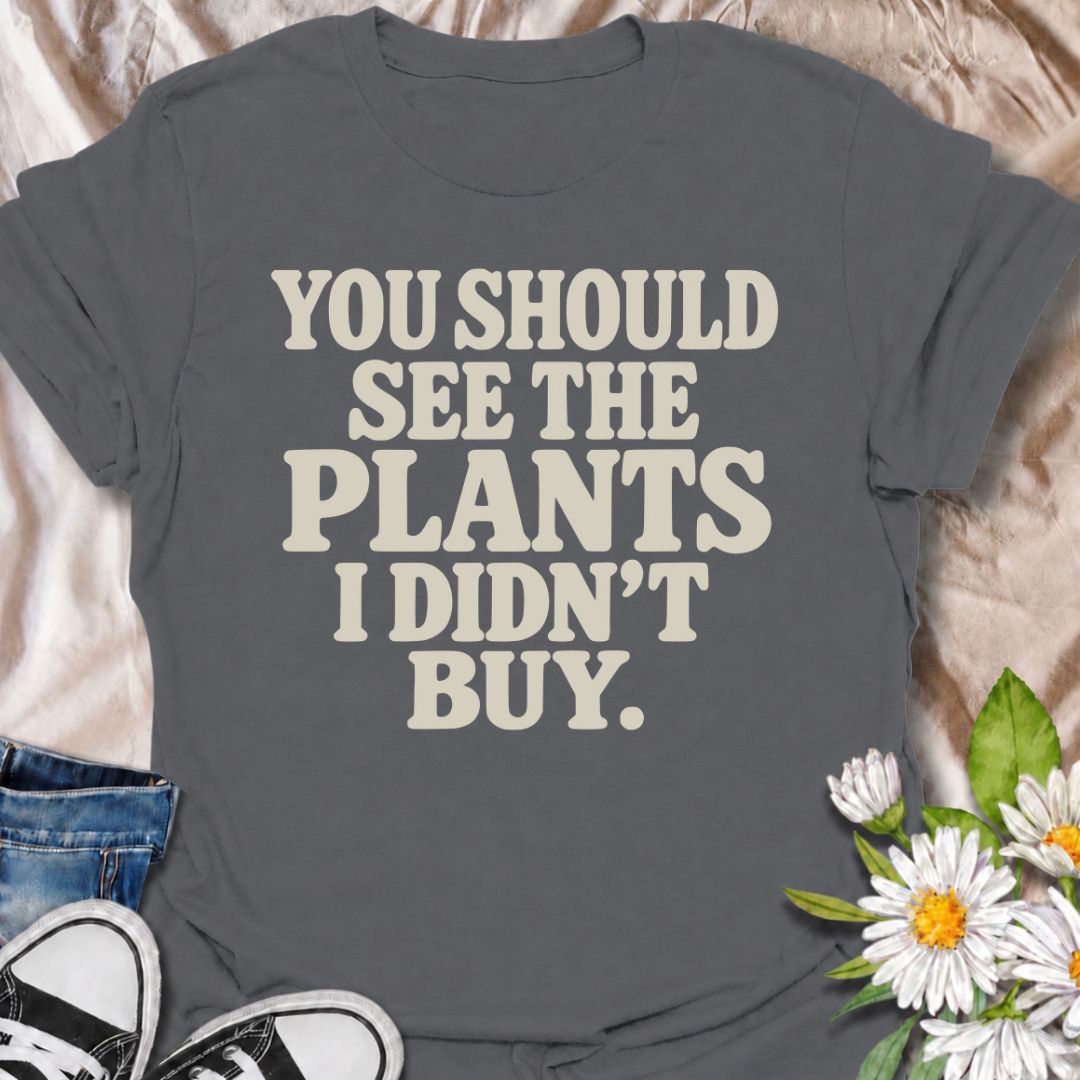 A funny plant T-shirt for anyone whose restraint deserves at least a little recognition. The phrase “You Should See the Plants I Didn’t Buy” delivers dry, self-aware humor that plant parents, nursery regulars, and houseplant collectors will instantly understand. Its bold retro typography keeps the design simple, readable, and easy to wear. It makes a great gift for plant lovers who somehow manage to leave the garden center with fewer plants than they wanted. Perfect for nursery trips, plant swaps, casual we