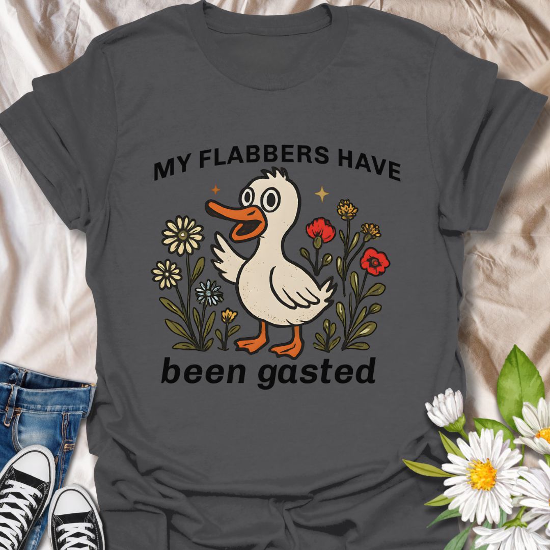 Add a splash of humor to your wardrobe with this quirky “My Flabbers Have Been Gasted” t-shirt featuring an adorable duck and whimsical flowers. A hilarious conversation starter and perfect gift for pun lovers, meme fans, or anyone who appreciates playful and unexpected expressions.