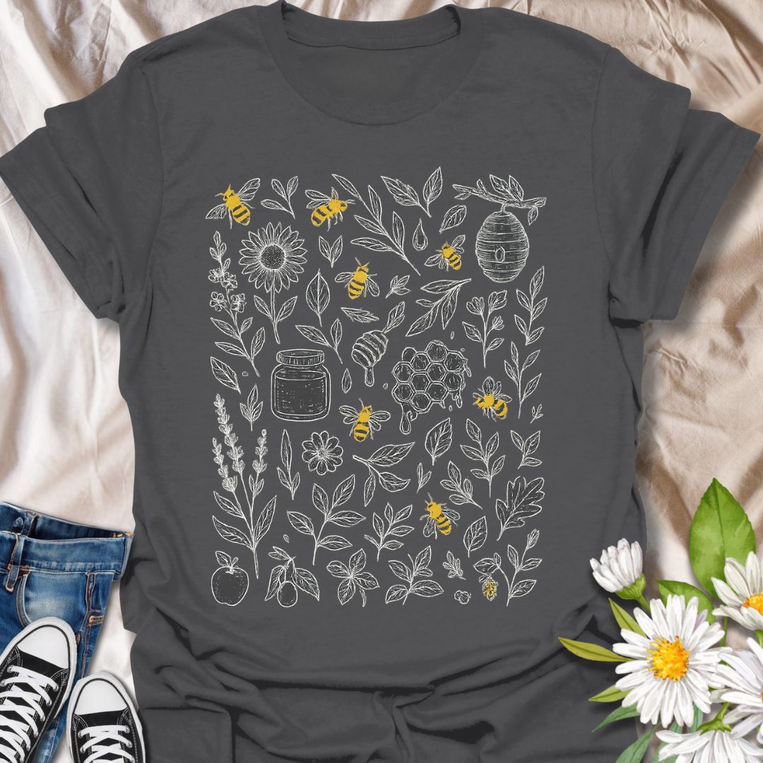 Celebrate nature and pollinator protection with this beautifully detailed t-shirt featuring hand-drawn floral illustrations and buzzing bees. A perfect choice for eco-conscious fashion lovers, gardeners, and bee conservation supporters who enjoy botanical and nature-inspired designs.