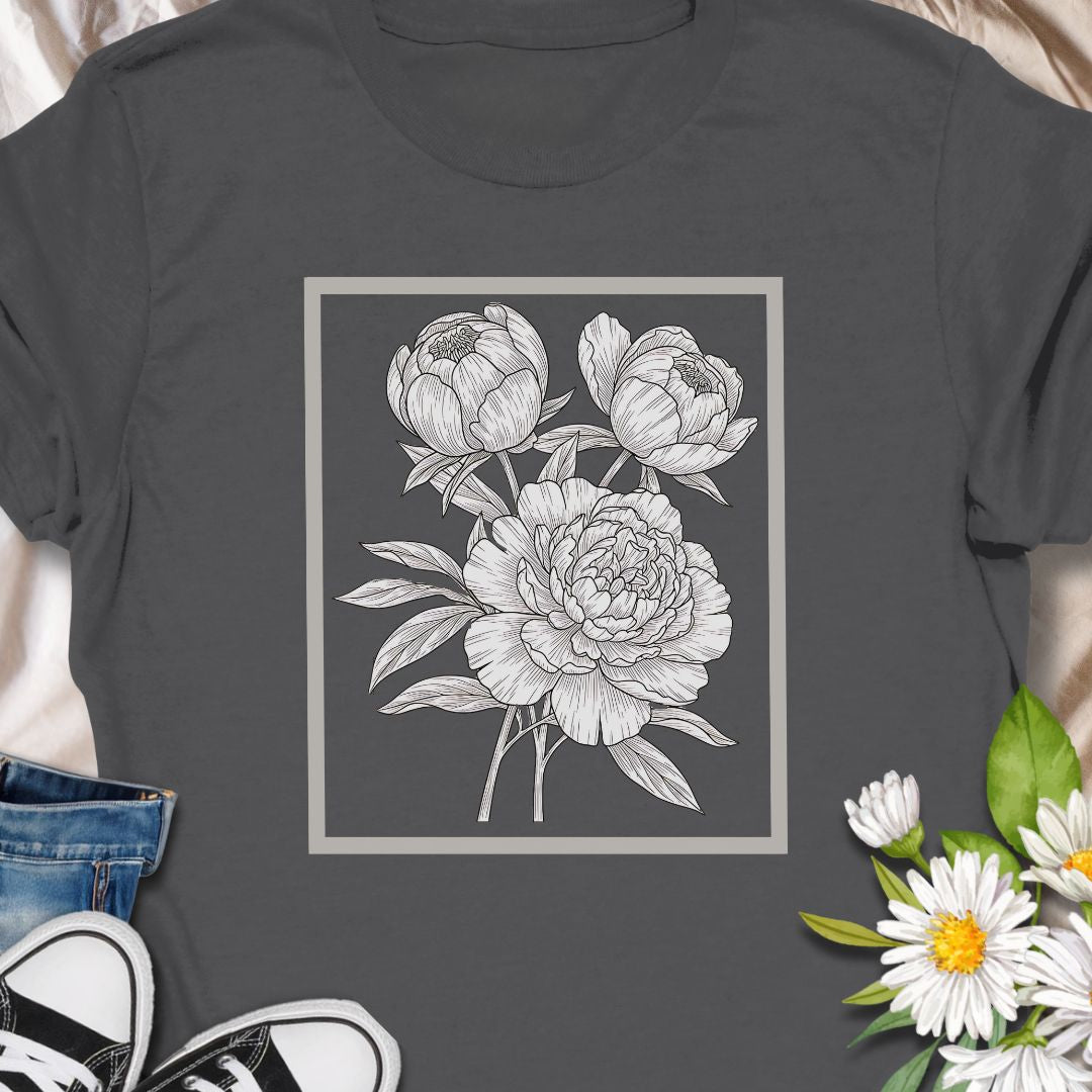 Elegant floral sketch tee featuring detailed peony artwork. Perfect for garden lovers and botanical art fans.  The clean, framed floral sits centered on the chest in fine-line detail — subtle enough to layer under a jacket, expressive enough to stand on its own.