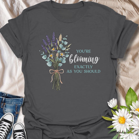 You’re blooming exactly as you should. This uplifting botanical t-shirt features a delicate wildflower bouquet and a positive affirmation celebrating growth, self-confidence, and gentle living. A meaningful gift for plant lovers, gardeners, and anyone on their own blooming journey.