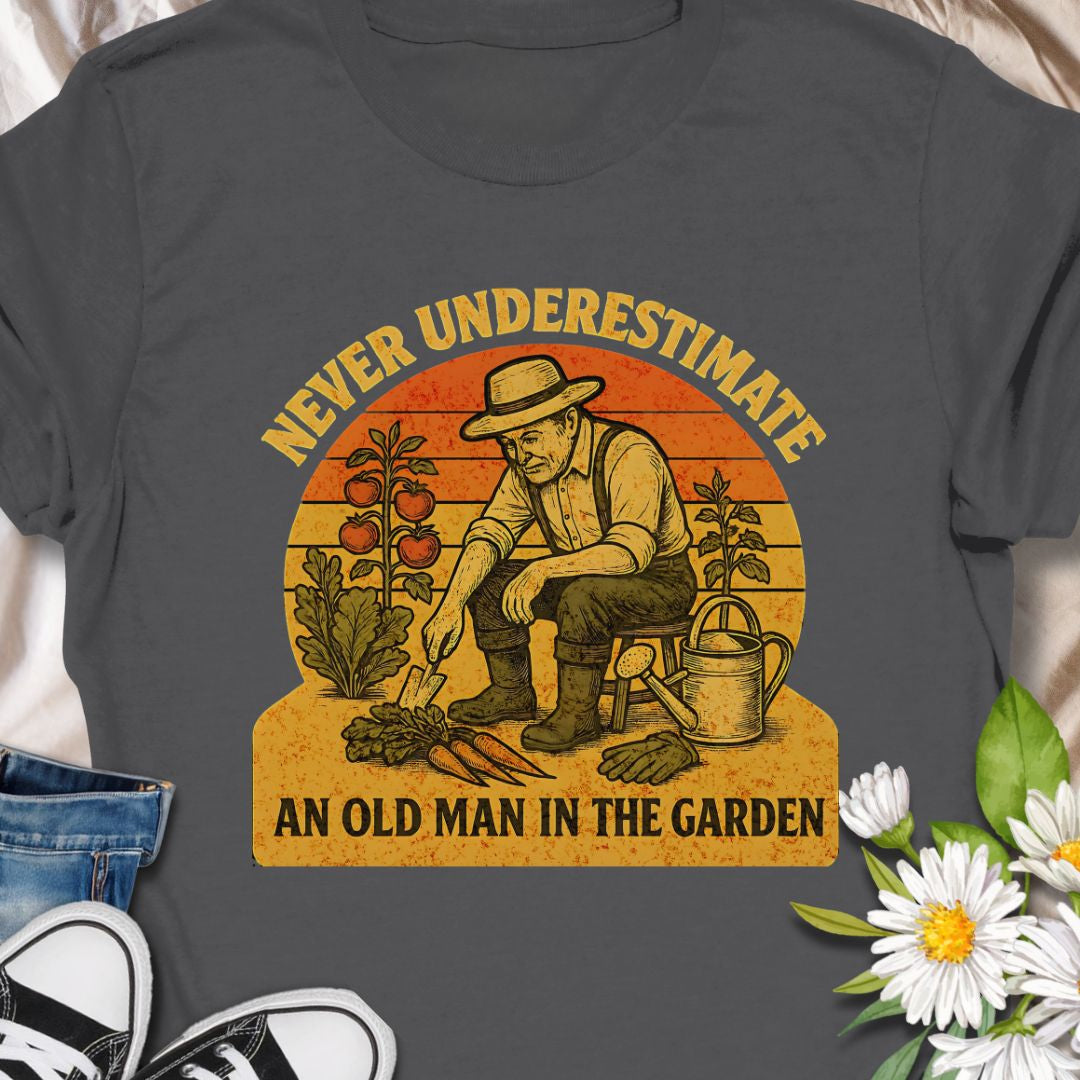 Celebrate gardening wisdom with this “Never Underestimate an Old Man in the Garden” tee featuring a retro-style illustration of a seasoned gardener harvesting his crops. A funny and heart warming shirt for grandpas, dads, or any experienced grower who takes pride in their garden. Makes a thoughtful gift for Father’s Day or retirement.