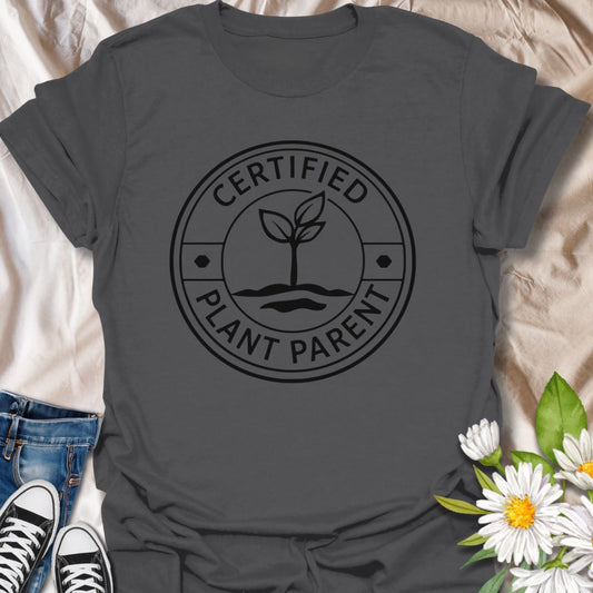 Show off your plant-loving pride with this “Certified Plant Parent” t-shirt, featuring a clean, minimalist badge-style design. Perfect for gardeners, houseplant enthusiasts, or green thumb gurus, this comfy tee makes a thoughtful gift for any plant lover who treats their foliage like family.