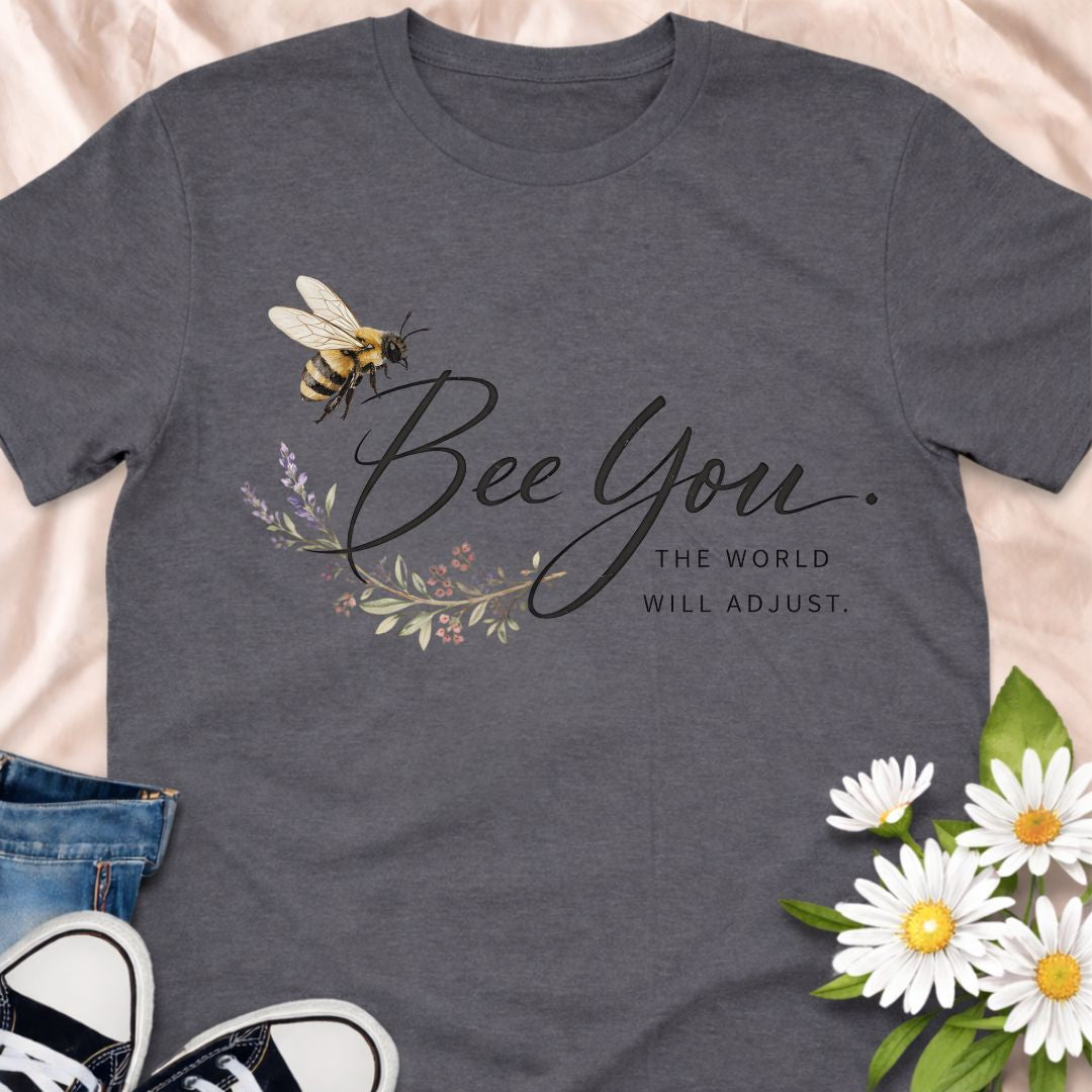 Bee You, the world will adjust. This inspirational bee and botanical t-shirt celebrates self-confidence, authenticity, and nature-led living. A thoughtful gift for bee lovers, plant lovers, and anyone who believes in staying true to themselves.