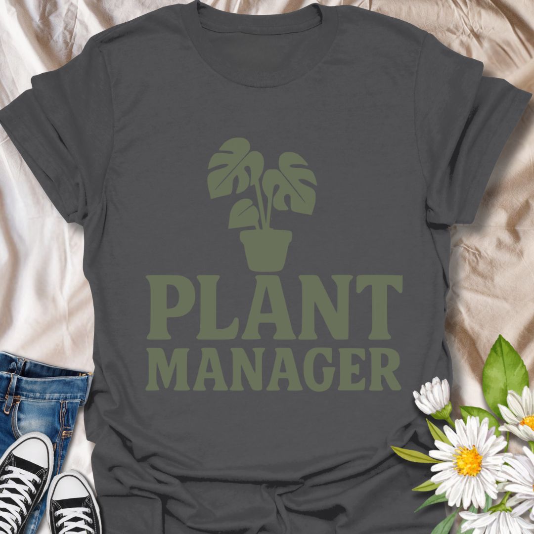 Show your houseplant pride with this humorous "Plant Manager" graphic t-shirt featuring a bold monstera illustration. Perfect for plant parents, gardening enthusiasts, and anyone who takes their indoor jungle seriously—with a sense of humor.