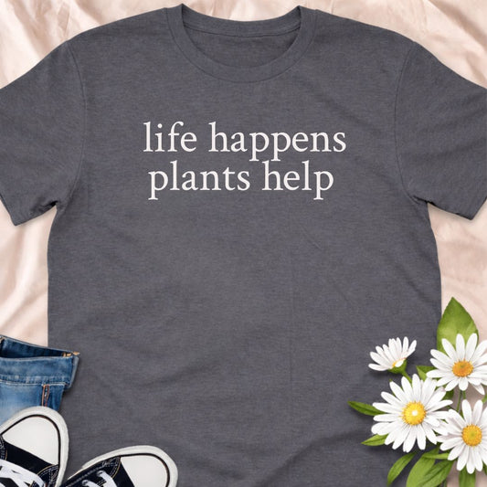 Life happens, plants help. This minimalist botanical t-shirt is designed for plant lovers, gardeners, and anyone who finds comfort in greenery. A calm, thoughtful tee that celebrates nature, self-care, and the healing power of plants.