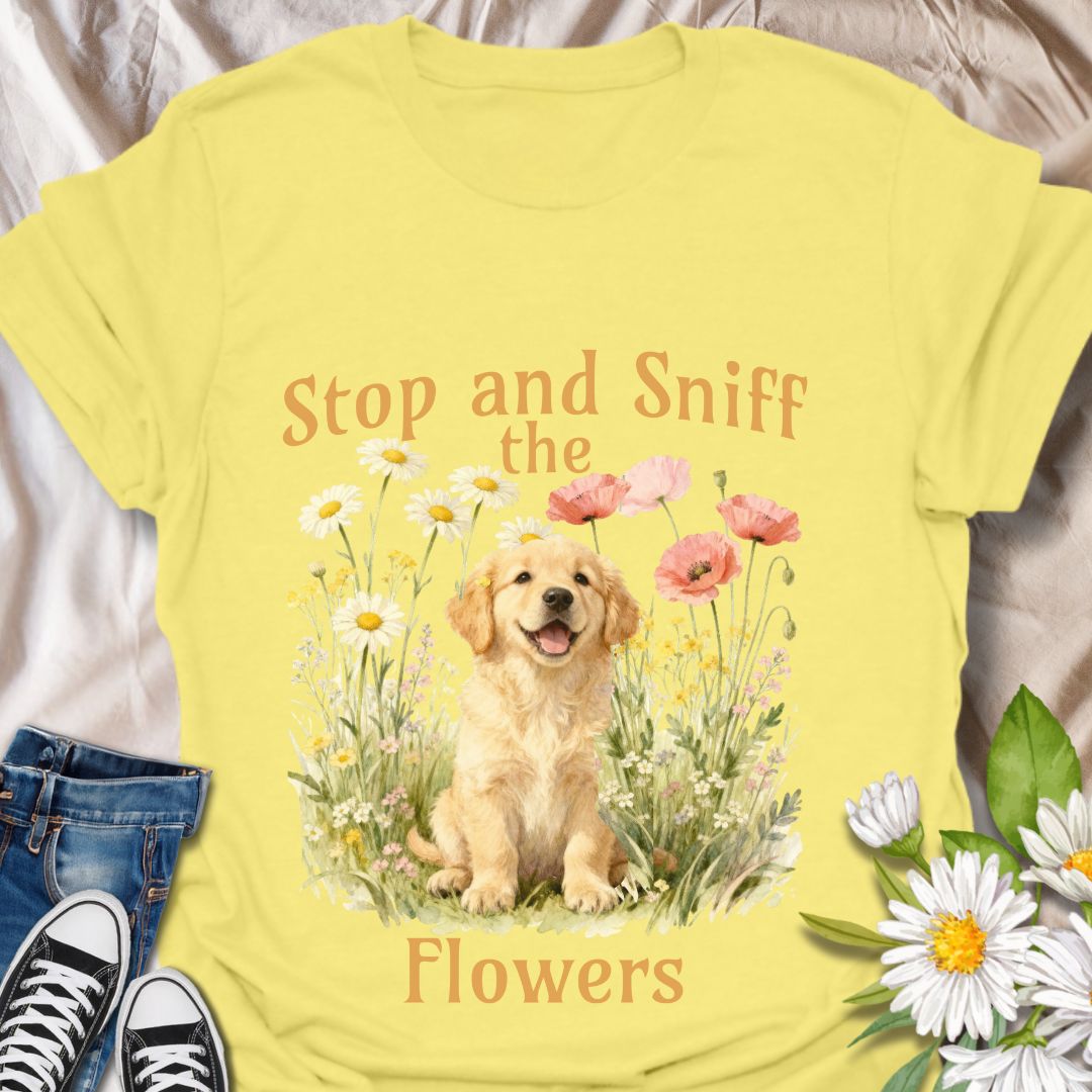 This adorable t-shirt combines floral charm with a happy pup and a gentle reminder to slow down and enjoy the little things. A fun design for dog lovers and garden enthusiasts alike.