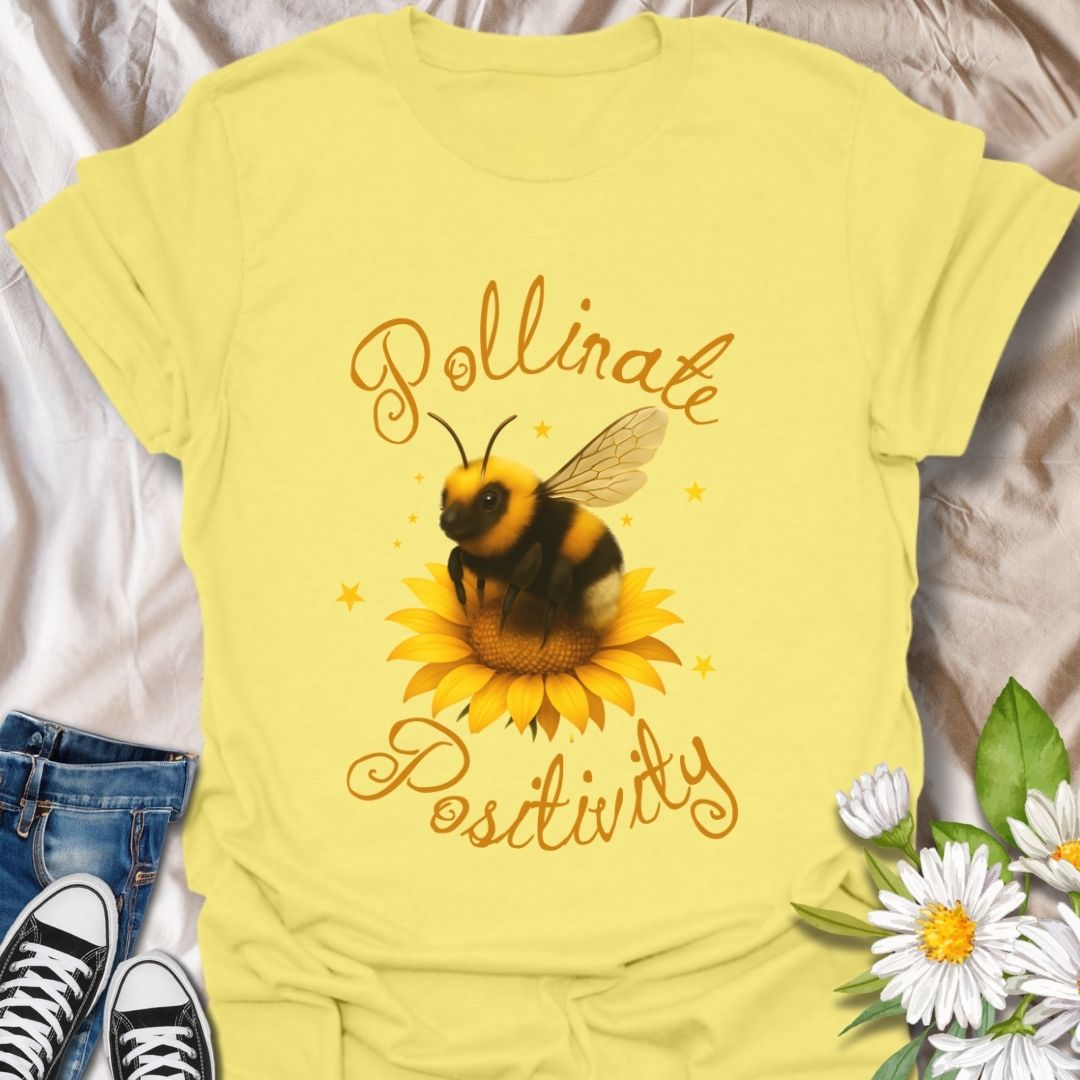 Pollinate Positivity t-shirt featuring a cute bumblebee on a bright sunflower, spreading good vibes and positive energy. Perfect bee lover shirt, nature-inspired graphic tee, gardening gift, or summer aesthetic outfit. Soft, lightweight, and ideal for women, teens, or anyone who loves bees, sunflowers, and inspirational quotes