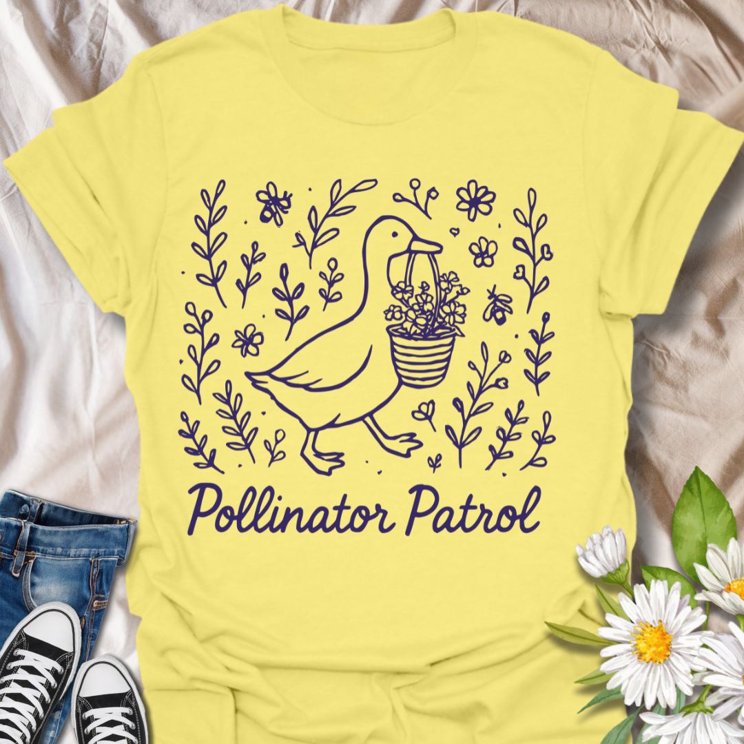 Charming ‘Pollinator Patrol’ goose shirt featuring a goose carrying flowers surrounded by bees and blooms. Perfect for gardeners, beekeepers, and wildlife conservation enthusiasts
