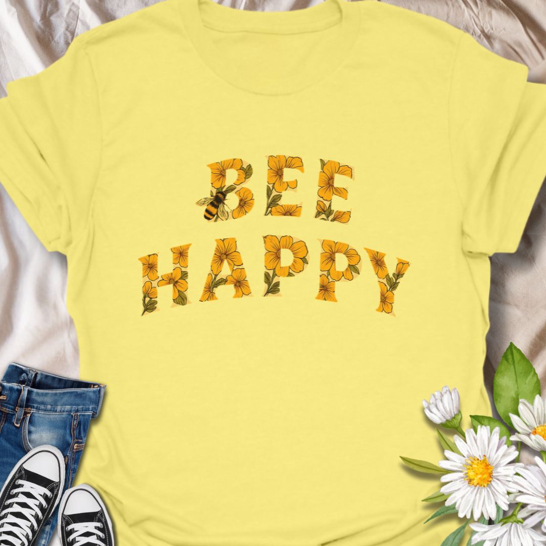 Spread positivity and nature-loving vibes with this charming “Bee Happy” t-shirt, featuring sunflower-filled typography and a playful bee motif. Perfect for beekeepers, garden lovers, and anyone who appreciates cheerful, nature-inspired fashion. A great gift for pollinator advocates and flower enthusiasts.