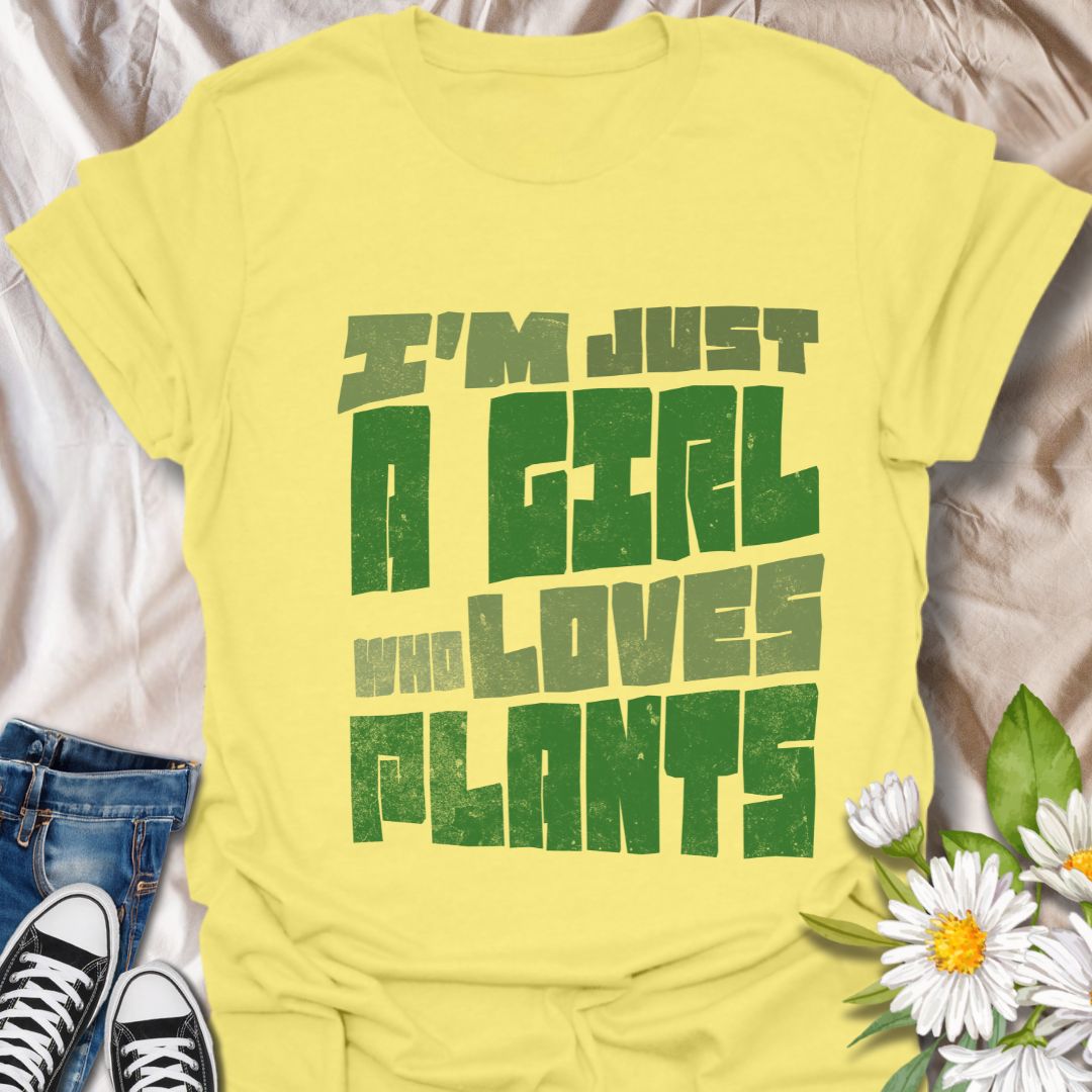 Bold statement t-shirt for plant lovers with the phrase “I’m Just a Girl Who Loves Plants” in rustic green text. Perfect gift for gardeners, plant moms, succulent fans, and nature enthusiasts who adore their indoor jungle or outdoor garden.