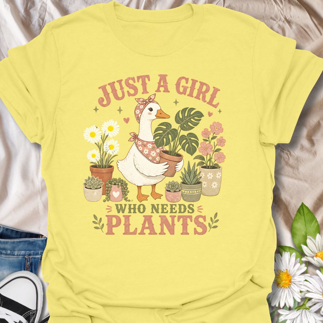 This Just A Girl Who Needs Plants t-shirt is made for plant lovers who know leafy friends, flowers, and a little garden time can fix almost anything. Featuring a sweet goose holding a potted monstera, surrounded by daisies, succulents, flowering plants, hearts, and soft botanical details, this design has a cute cottagecore-inspired feel. Perfect for plant moms, gardeners, houseplant collectors, flower fans, and anyone who proudly needs more plants in their life.