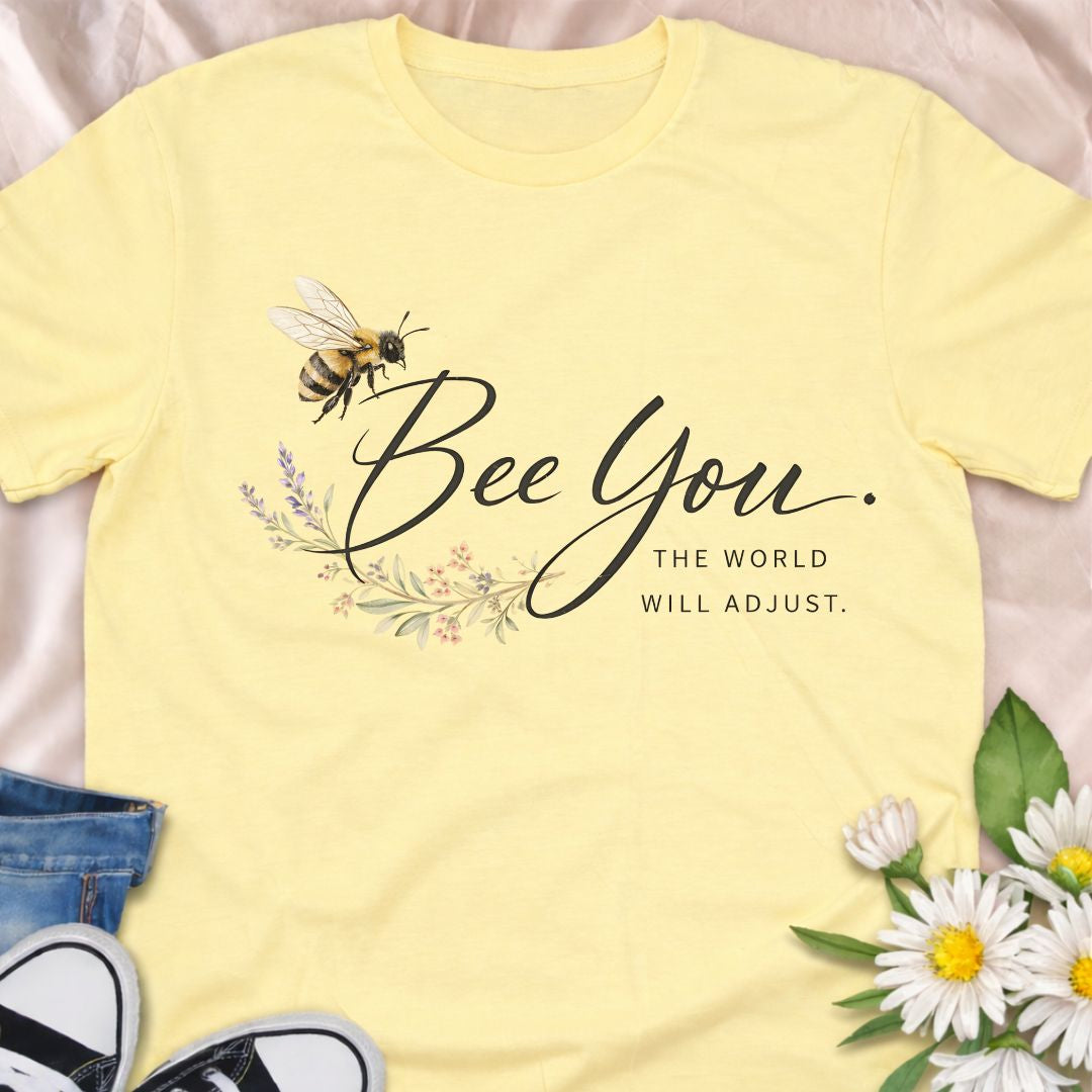 Bee You, the world will adjust. This inspirational bee and botanical t-shirt celebrates self-confidence, authenticity, and nature-led living. A thoughtful gift for bee lovers, plant lovers, and anyone who believes in staying true to themselves.
