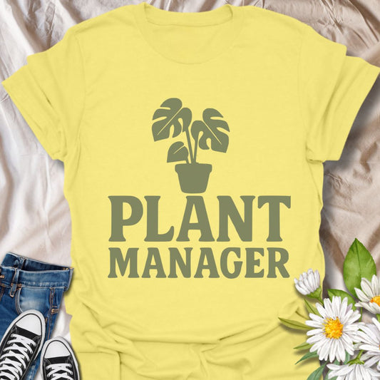 Show your houseplant pride with this humorous "Plant Manager" graphic t-shirt featuring a bold monstera illustration. Perfect for plant parents, gardening enthusiasts, and anyone who takes their indoor jungle seriously—with a sense of humor.