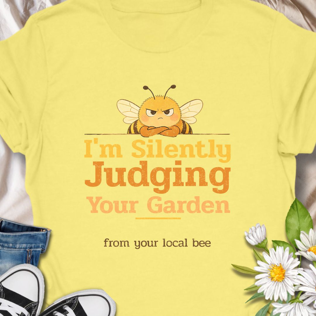 Let your inner bee do the talking with this hilarious “I’m Silently Judging Your Garden” T-shirt featuring a grumpy bee. Perfect for gardeners, plant lovers, and pollinator protectors with a sarcastic sense of humor. A playful gift for bee enthusiasts and backyard botanists alike.