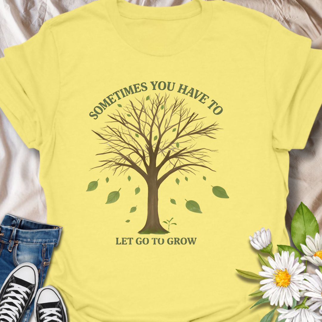 Embrace change and personal growth with this inspirational “Sometimes You Have to Let Go to Grow” t-shirt. Featuring a minimalist tree shedding leaves, this motivational nature-themed design is perfect for anyone navigating transformation, healing, or new beginnings. A thoughtful gift for plant lovers, nature fans, or those on a journey of self-growth.
