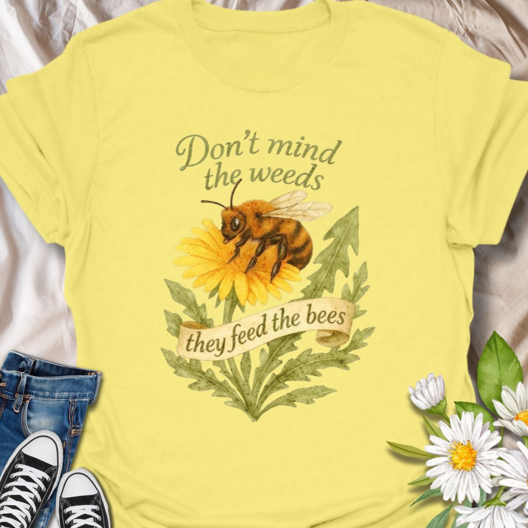 Support pollinators in style with this charming “Don’t Mind the Weeds, They Feed the Bees” t-shirt. Featuring a hand-drawn bee and dandelion artwork, this eco-friendly message tee is perfect for gardeners, nature lovers, and bee advocates who know weeds can be beautiful too.