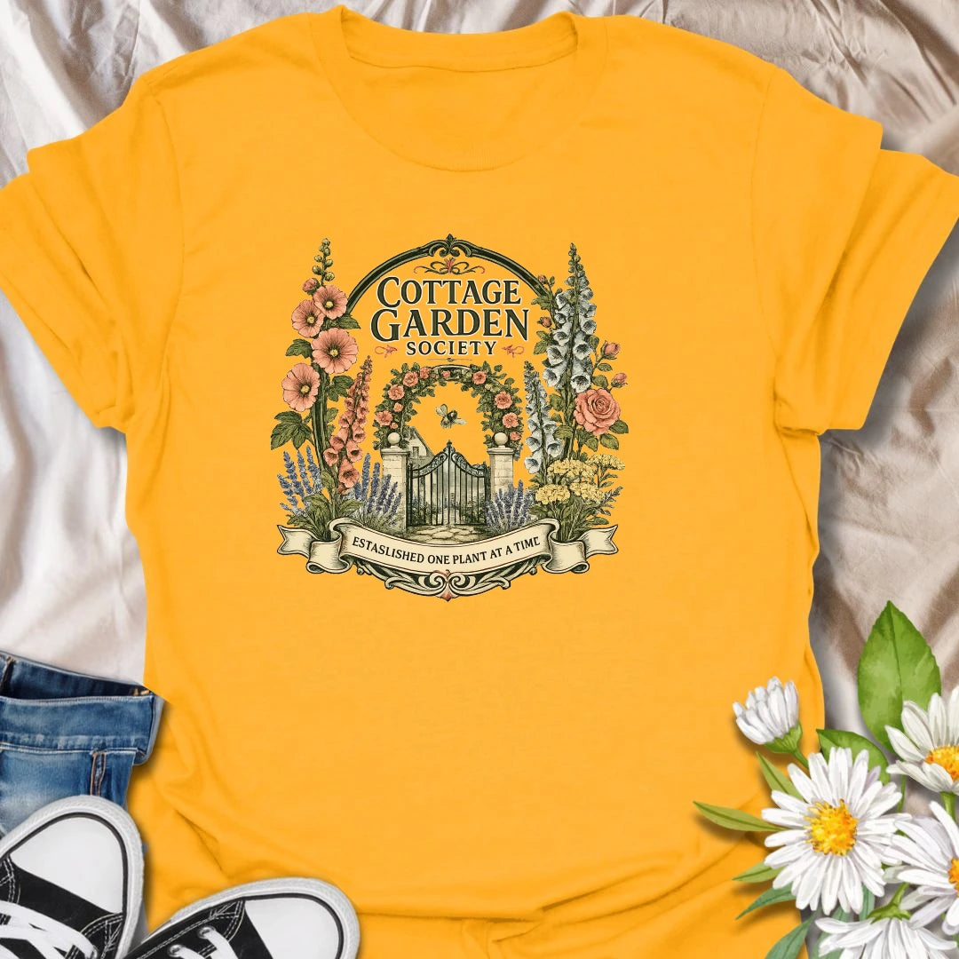 Cottage garden t-shirt with floral gate artwork, vintage garden society style, and a soft botanical feel for gardeners and flower lovers.