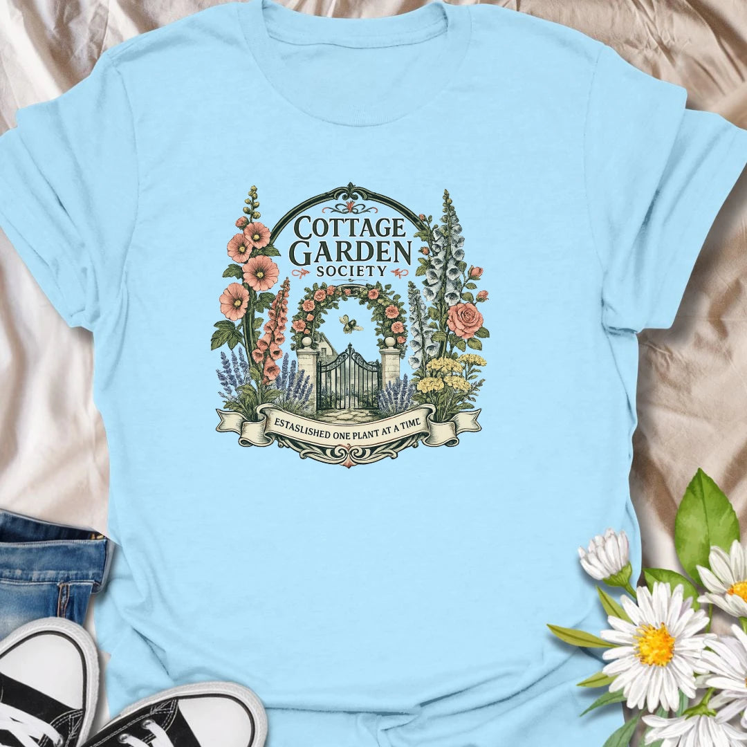 Cottage garden t-shirt with floral gate artwork, vintage garden society style, and a soft botanical feel for gardeners and flower lovers.