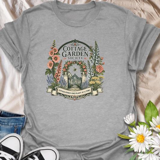Cottage garden t-shirt with floral gate artwork, vintage garden society style, and a soft botanical feel for gardeners and flower lovers.