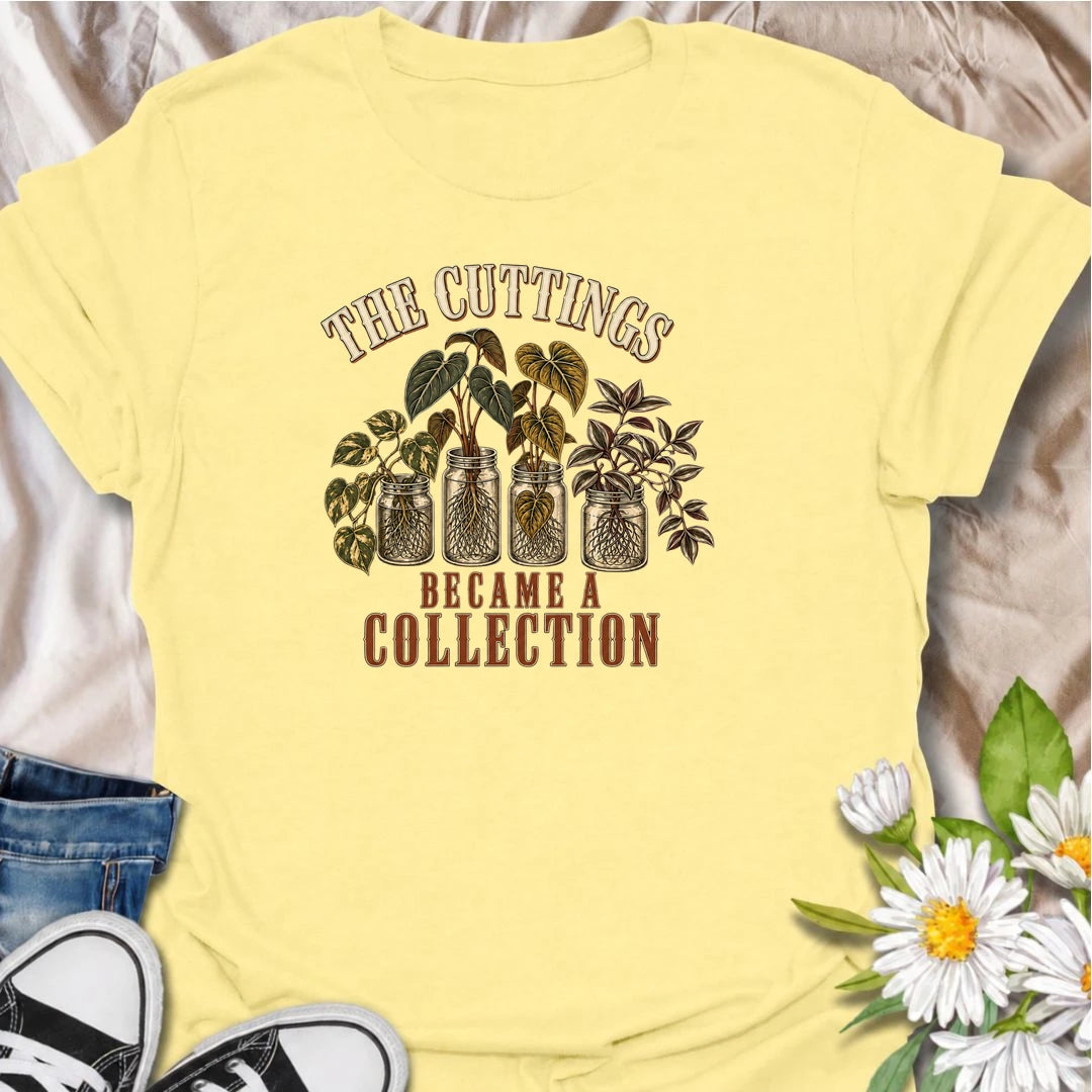 A funny propagation T-shirt for plant lovers who started with one cutting and somehow ended up with an entire collection. Featuring rooted houseplant cuttings growing in glass jars, this design is perfect for propagation fans, plant parents, and indoor gardeners. The phrase “The Cuttings Became a Collection” captures that very familiar moment when a simple hobby turns into another shelf full of plants. It makes a great gift for pothos lovers, monstera fans, and anyone who is always saving, swapping, or root