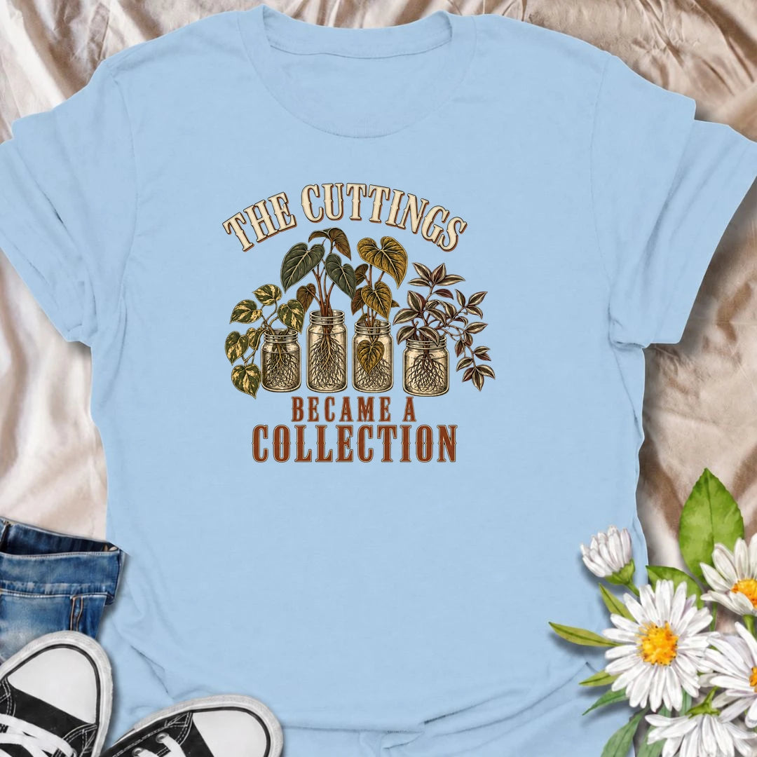 A funny propagation T-shirt for plant lovers who started with one cutting and somehow ended up with an entire collection. Featuring rooted houseplant cuttings growing in glass jars, this design is perfect for propagation fans, plant parents, and indoor gardeners. The phrase “The Cuttings Became a Collection” captures that very familiar moment when a simple hobby turns into another shelf full of plants. It makes a great gift for pothos lovers, monstera fans, and anyone who is always saving, swapping, or root