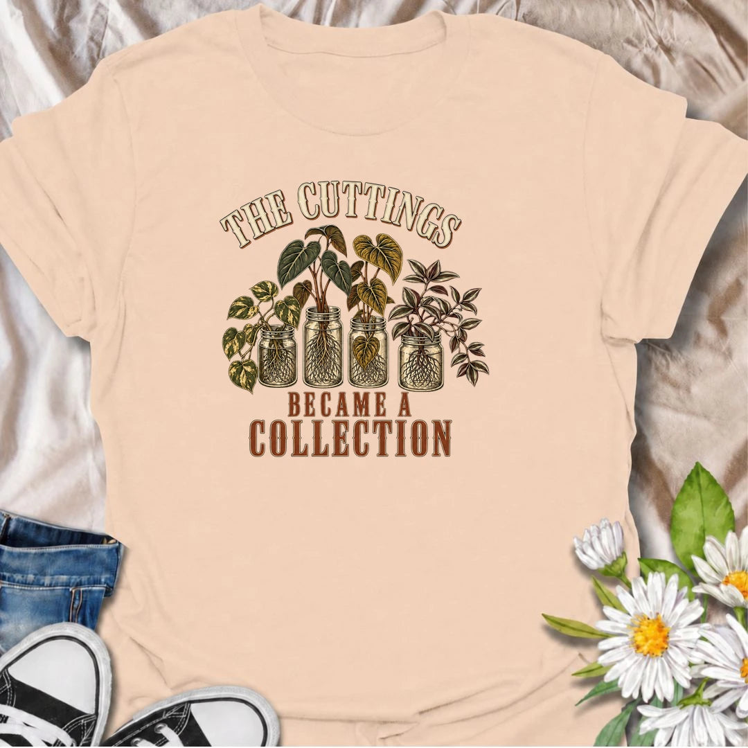 A funny propagation T-shirt for plant lovers who started with one cutting and somehow ended up with an entire collection. Featuring rooted houseplant cuttings growing in glass jars, this design is perfect for propagation fans, plant parents, and indoor gardeners. The phrase “The Cuttings Became a Collection” captures that very familiar moment when a simple hobby turns into another shelf full of plants. It makes a great gift for pothos lovers, monstera fans, and anyone who is always saving, swapping, or root