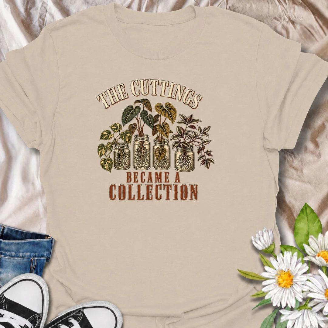 A funny propagation T-shirt for plant lovers who started with one cutting and somehow ended up with an entire collection. Featuring rooted houseplant cuttings growing in glass jars, this design is perfect for propagation fans, plant parents, and indoor gardeners. The phrase “The Cuttings Became a Collection” captures that very familiar moment when a simple hobby turns into another shelf full of plants. It makes a great gift for pothos lovers, monstera fans, and anyone who is always saving, swapping, or root