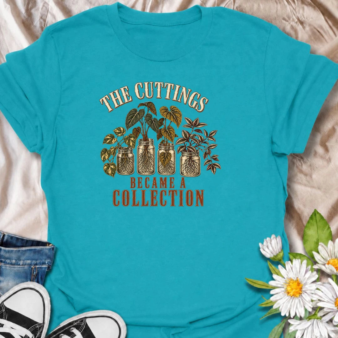 A funny propagation T-shirt for plant lovers who started with one cutting and somehow ended up with an entire collection. Featuring rooted houseplant cuttings growing in glass jars, this design is perfect for propagation fans, plant parents, and indoor gardeners. The phrase “The Cuttings Became a Collection” captures that very familiar moment when a simple hobby turns into another shelf full of plants. It makes a great gift for pothos lovers, monstera fans, and anyone who is always saving, swapping, or root