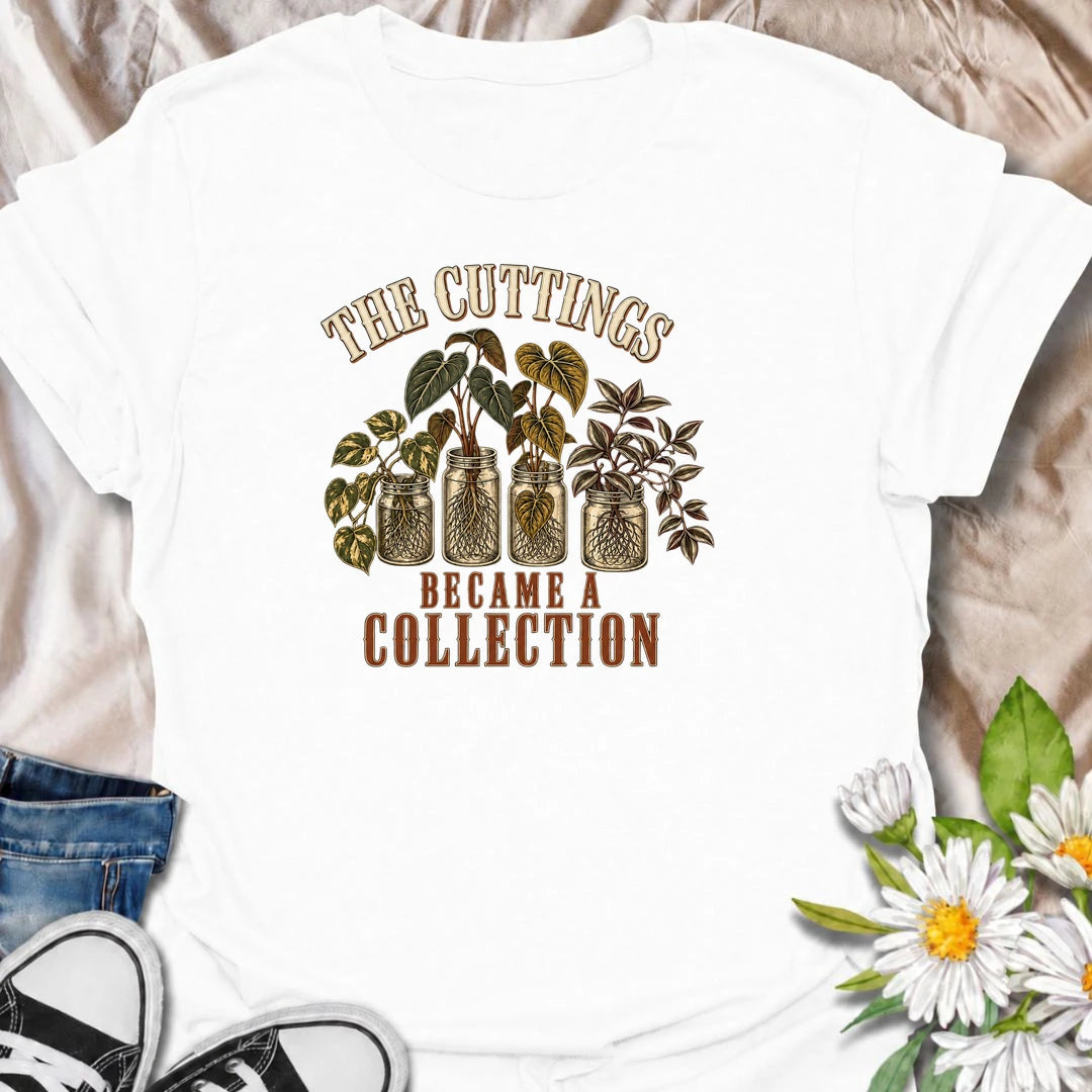 A funny propagation T-shirt for plant lovers who started with one cutting and somehow ended up with an entire collection. Featuring rooted houseplant cuttings growing in glass jars, this design is perfect for propagation fans, plant parents, and indoor gardeners. The phrase “The Cuttings Became a Collection” captures that very familiar moment when a simple hobby turns into another shelf full of plants. It makes a great gift for pothos lovers, monstera fans, and anyone who is always saving, swapping, or root
