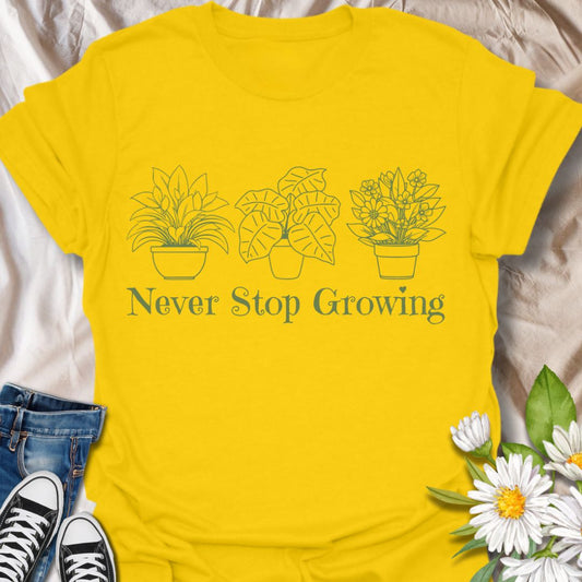 Encourage growth and positivity with this minimalist plant pots t-shirt that reads “Never Stop Growing.” A perfect daily inspiration tee for gardeners, plant lovers, and growth-minded individuals.