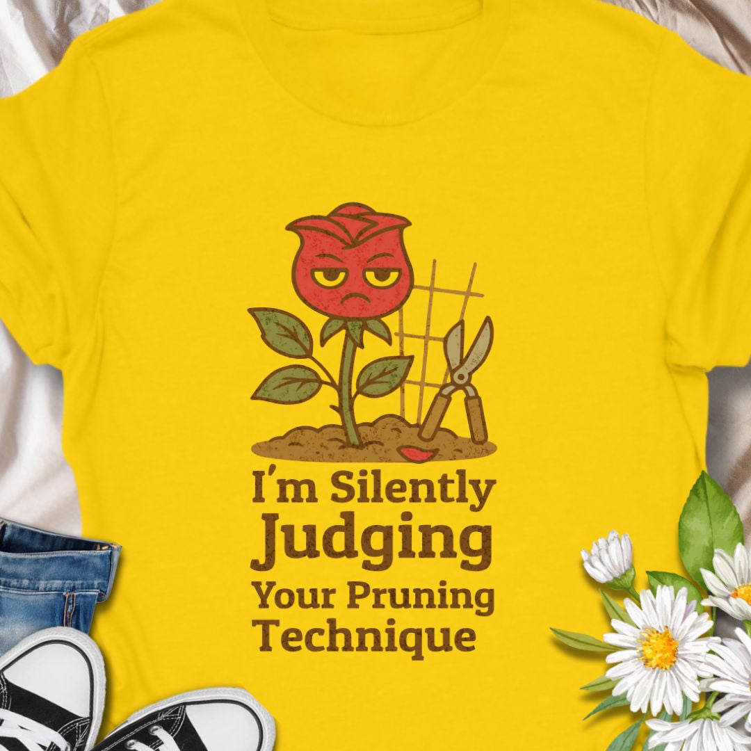 Bring humor to the garden with this “I’m Silently Judging Your Pruning Technique” shirt featuring a sassy red rose. Perfect for gardeners who love their plants trimmed just right and have a sense of humor to match. Makes a great gift for plant lovers and gardening enthusiasts.