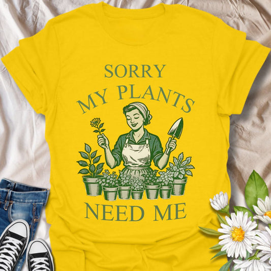Celebrate your love for gardening with this vintage-style graphic t-shirt featuring a retro gardener surrounded by plants and the funny phrase "Sorry, My Plants Need Me." Perfect for plant parents, garden enthusiasts, and anyone proud of their green thumb.