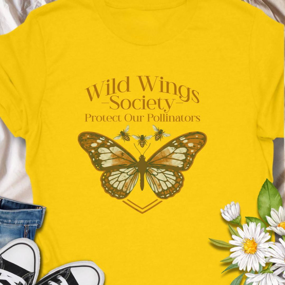 Butterfly conservation themed shirt with 'Wild Wings Society' design. Great for nature lovers and pollinator protectors.   Soft, worn-in comfort meets quiet activism - a warm-toned monarch rests at the center of a vintage-inspired crest, with the words “Wild Wings Society — Protect Our Pollinators” arched above. 