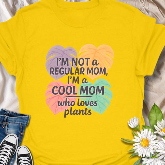 Add some sass to your leafy lifestyle with this vibrant “I’m Not a Regular Mom, I’m a Cool Mom Who Loves Plants” t-shirt. Perfect for moms with a green thumb and a great sense of humor, this colorful plant-themed tee is a fun gift idea for Mother’s Day, birthdays, or just because. Designed for stylish plant moms who take pride in their jungle.