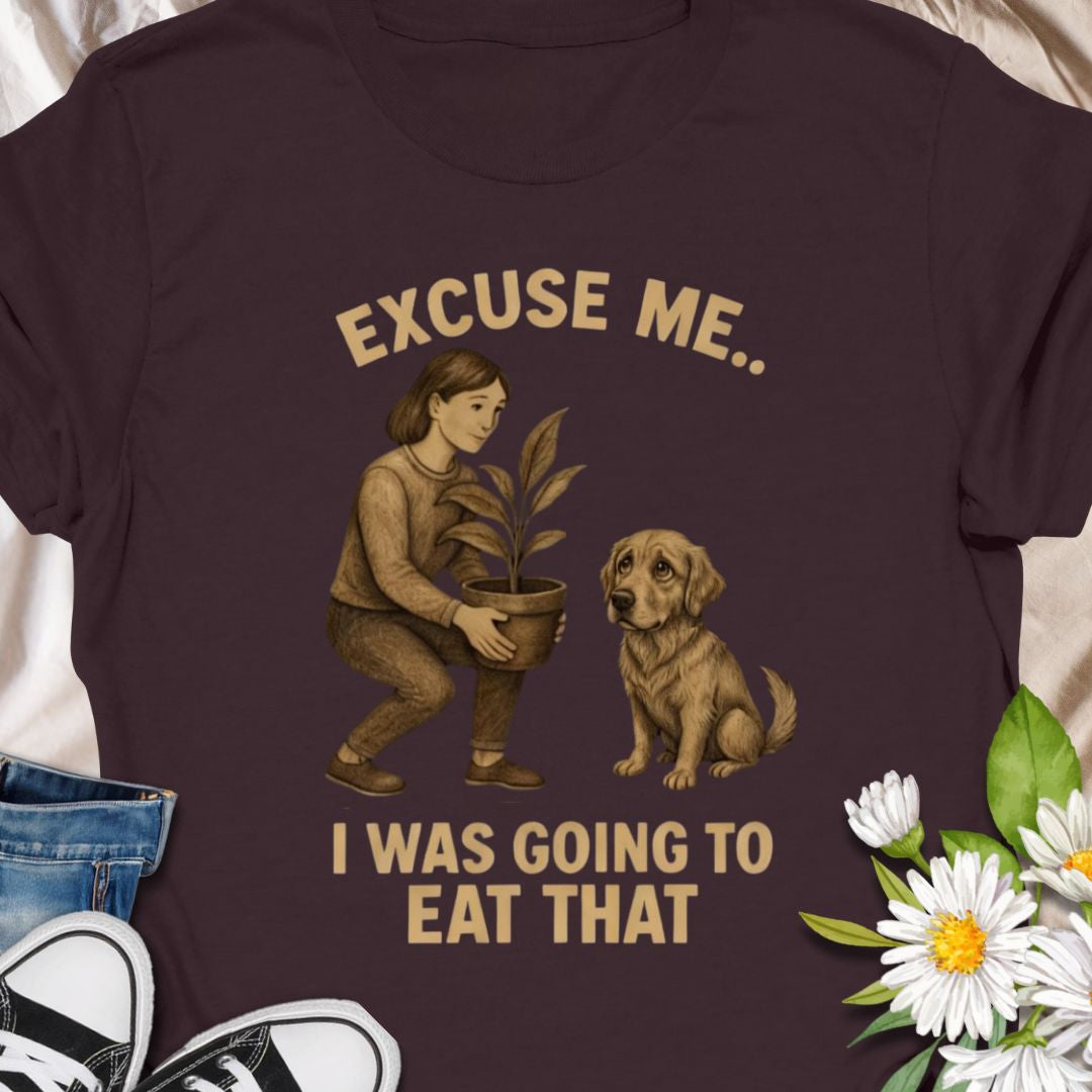 Funny dog and plant shirt showing a dog eyeing a houseplant. A humorous gift for dog owners and plant lovers.