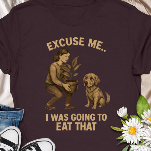 Funny dog and plant shirt showing a dog eyeing a houseplant. A humorous gift for dog owners and plant lovers.