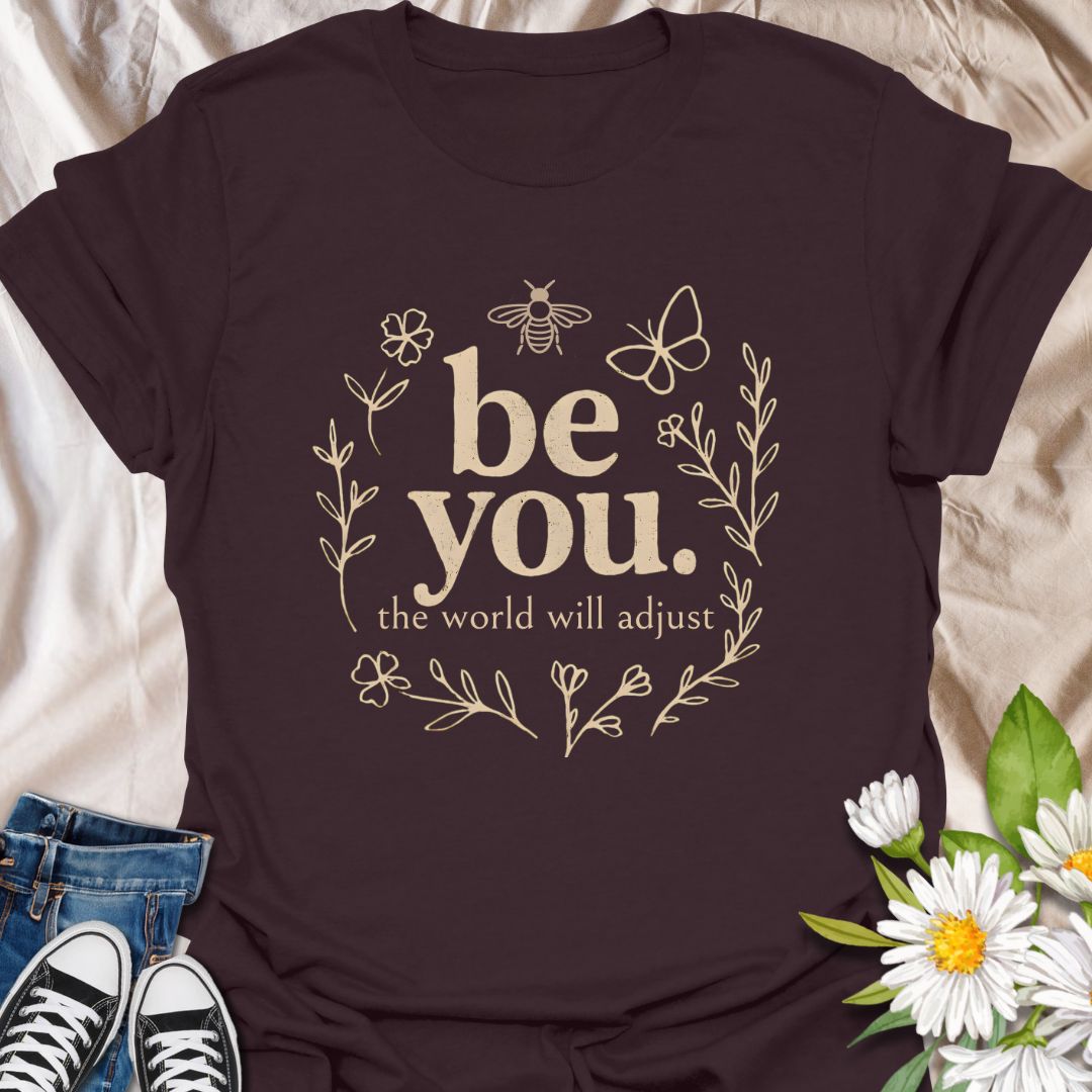 Empower your individuality with this inspiring “be you, the world will adjust” t-shirt design. Featuring whimsical floral and nature-themed elements like bees and butterflies, this uplifting graphic tee promotes self-love, confidence, and authenticity — ideal for free spirits and positivity lovers.