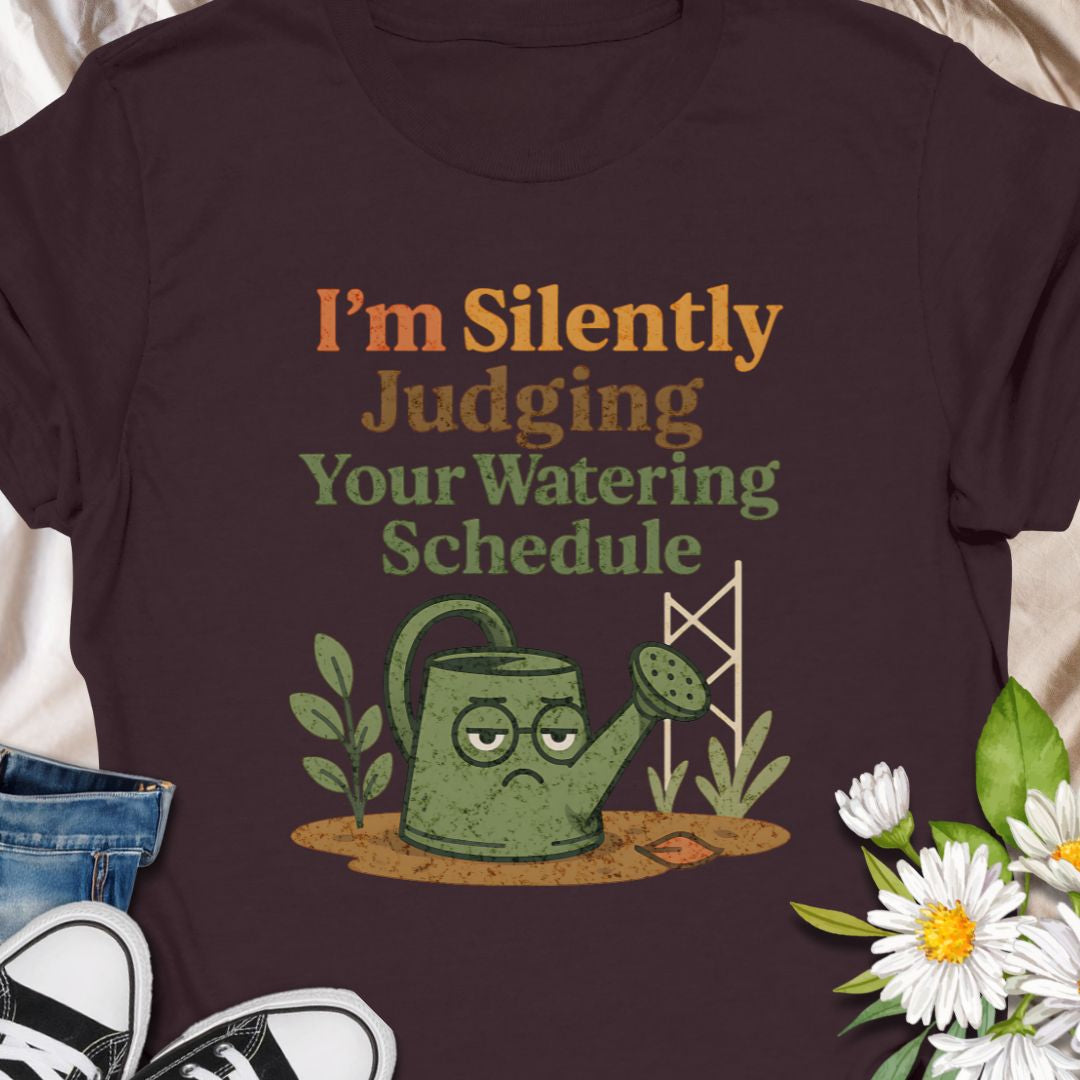 Show off your plant-parent sass with this “I’m Silently Judging Your Watering Schedule” tee featuring a grumpy watering can. A hilarious gift for  moms, dads who enjoy their gardens, and anyone with a love for keeping their leafy friends happy. Ideal for houseplant lovers and garden geeks alike.