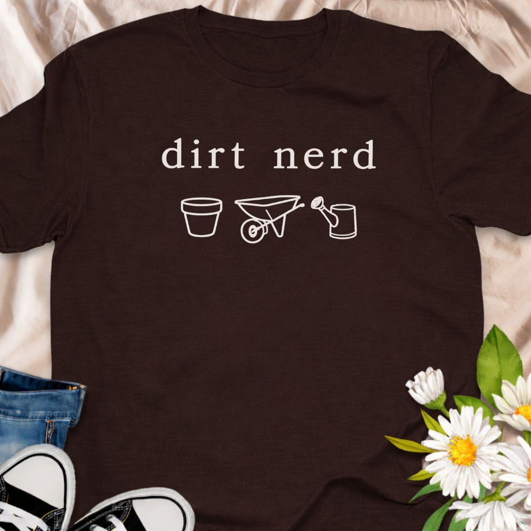 “Dirt Nerd” minimalist gardening t-shirt for plant lovers and gardeners. Subtle botanical humour tee featuring simple garden icons. Perfect for plant parents, garden enthusiasts, and anyone proudly obsessed with soil, plants, and growing things. A great gift for gardeners and plant nerds.