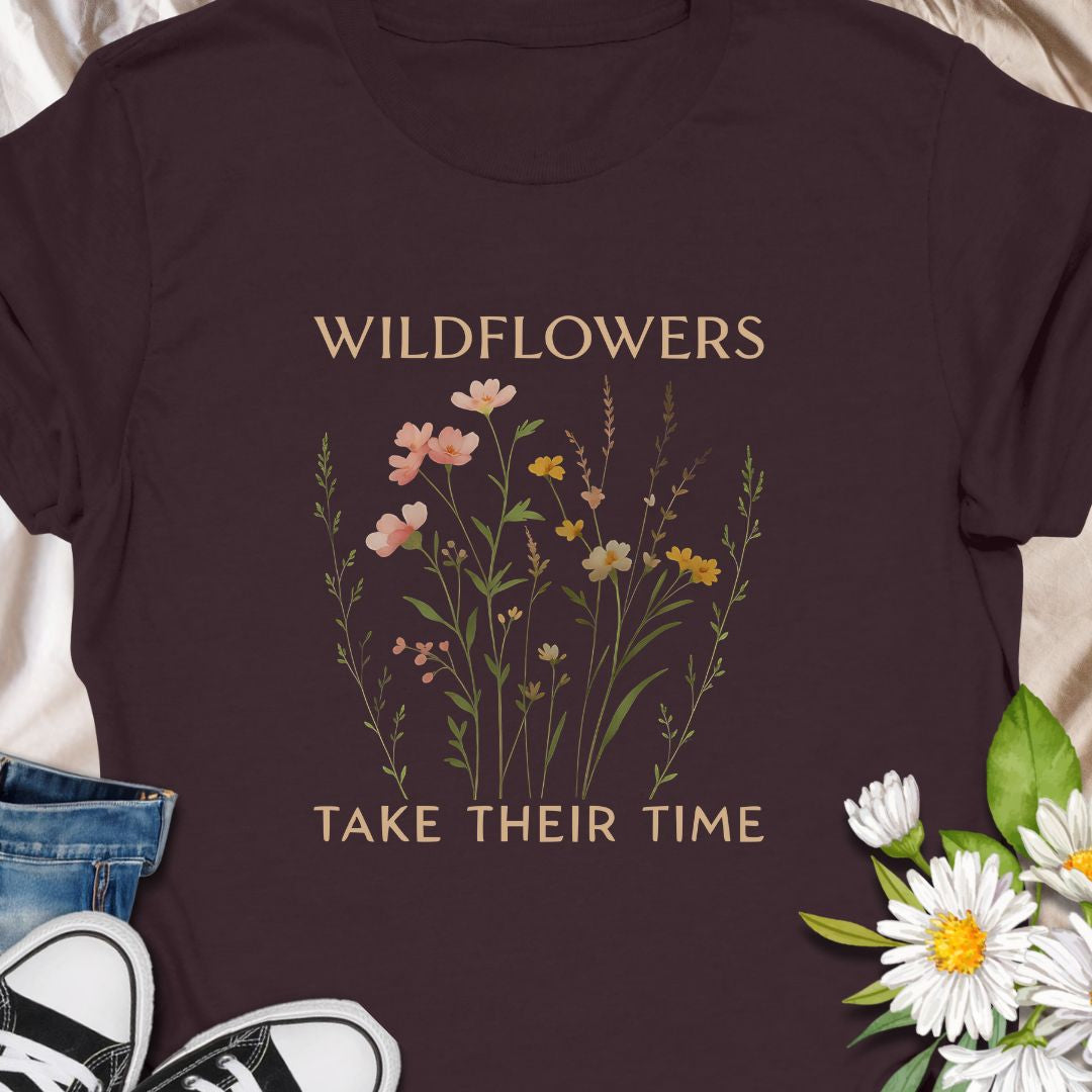Inspirational wildflower tee featuring soft meadow flowers and motivational quote. A calming nature-themed shirt.