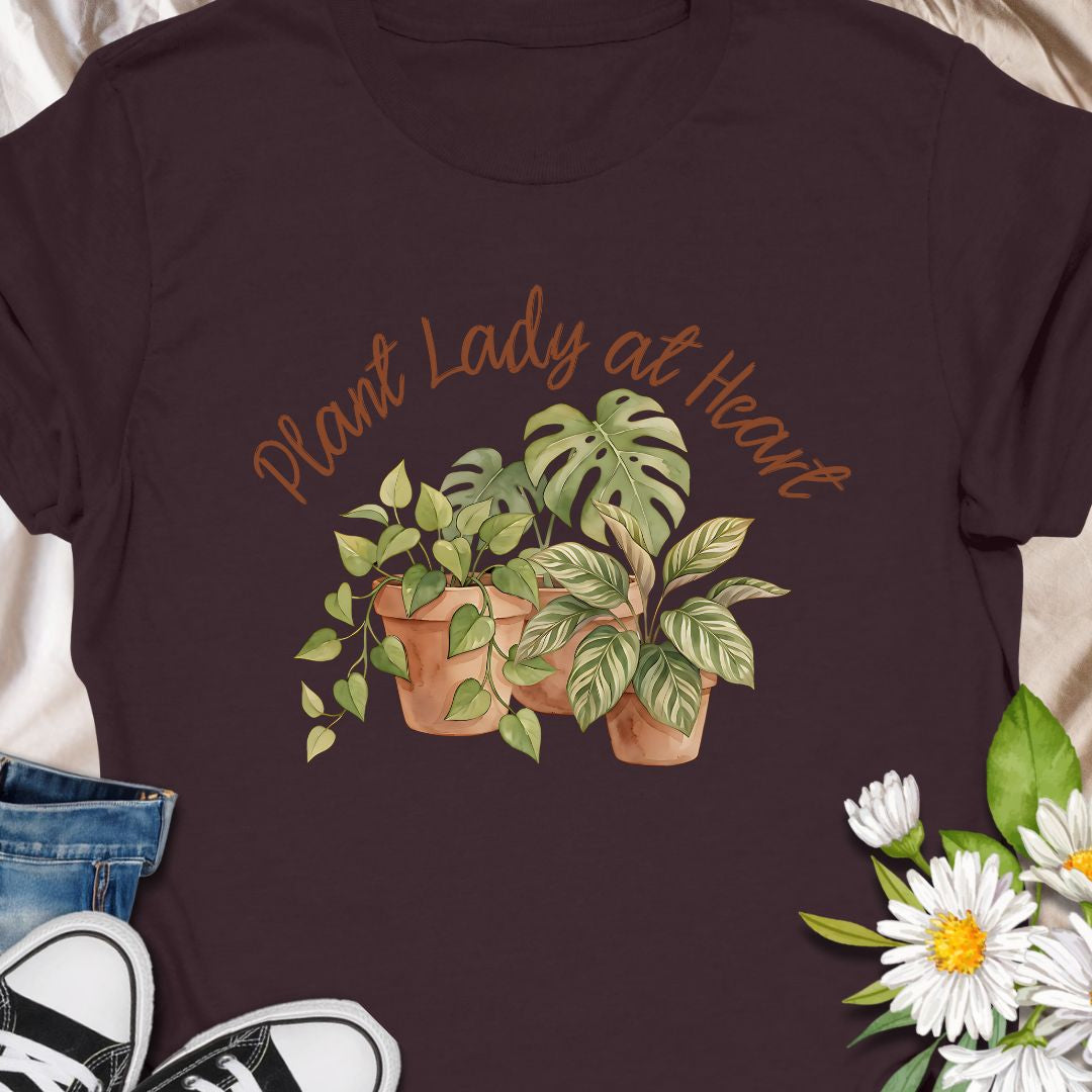 Celebrate your love for greenery with this charming “Plant Lady at Heart” t-shirt. Featuring soft water color-style potted plants and elegant script text, it’s the perfect gift for plant moms, gardeners, and nature enthusiasts. Wear it proudly and show the world that your heart truly belongs to plants—comfort meets style in this must-have tee.