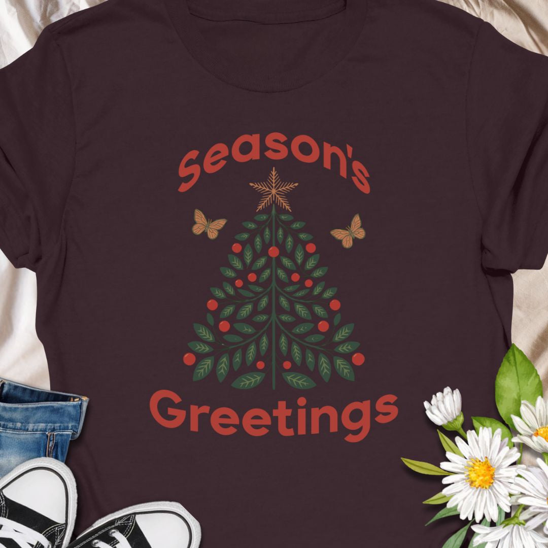 Spread festive cheer with this charming “Season’s Greetings” t-shirt featuring a leafy Christmas tree and butterflies. A unique and nature-inspired holiday tee perfect for garden lovers and anyone who celebrates the season in style.