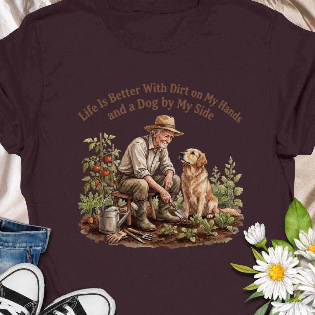 Celebrate the joys of gardening and loyal companionship with this heart warming “Life Is Better With Dirt on My Hands and a Dog by My Side” t-shirt. Featuring a vintage-style illustration of a man and his dog in the garden, this tee is perfect for nature lovers, dog dads, or anyone who finds peace in plants and paws. A thoughtful gift for birthdays, Father’s Day, or just because.