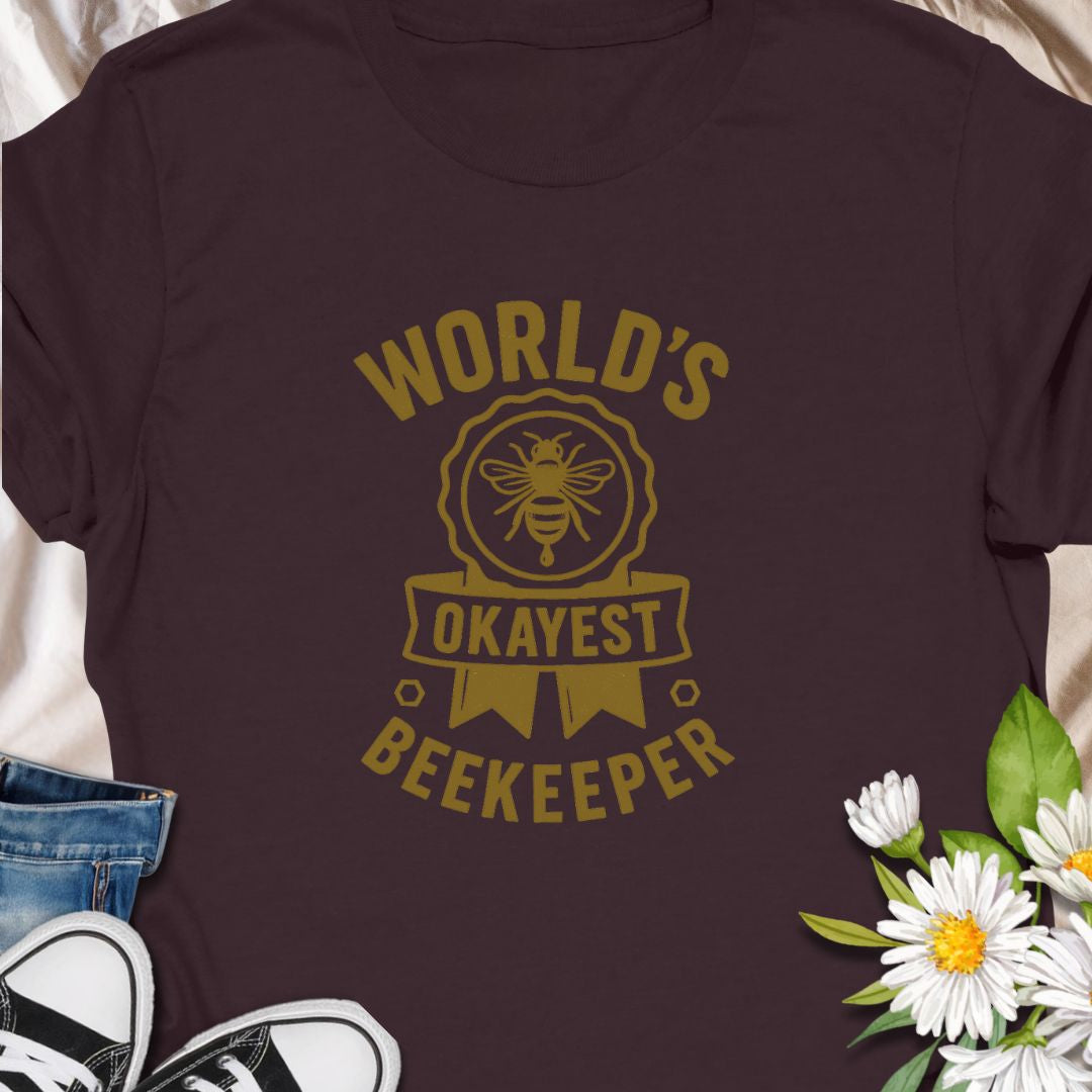 Celebrate your love for beekeeping with a humorous twist in this "World's Okayest Beekeeper" T-Shirt. Perfect for backyard beekeepers, honey lovers, and bee enthusiasts who know it's not about perfection—it's about passion. Makes a great gift for bee dads, moms, hobbyists, and anyone who keeps buzzing through life.