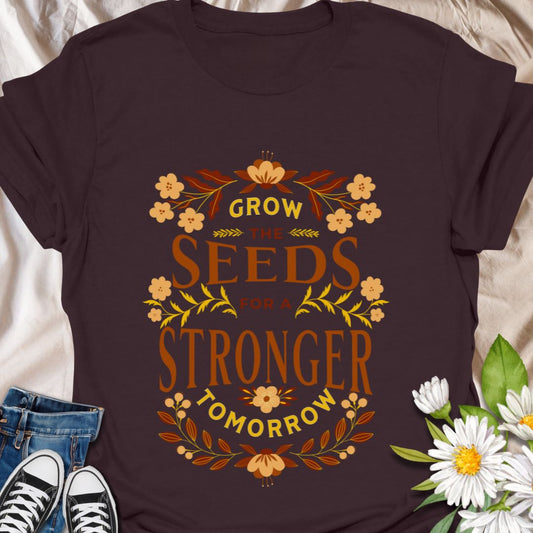 Inspire growth and positive change with this motivational “Grow the Seeds for a Stronger Tomorrow” t-shirt. Perfect for garden lovers, environmental advocates, teachers, and anyone passionate about making an impact. A stylish way to spread hope, sustainability, and forward-thinking vibes.