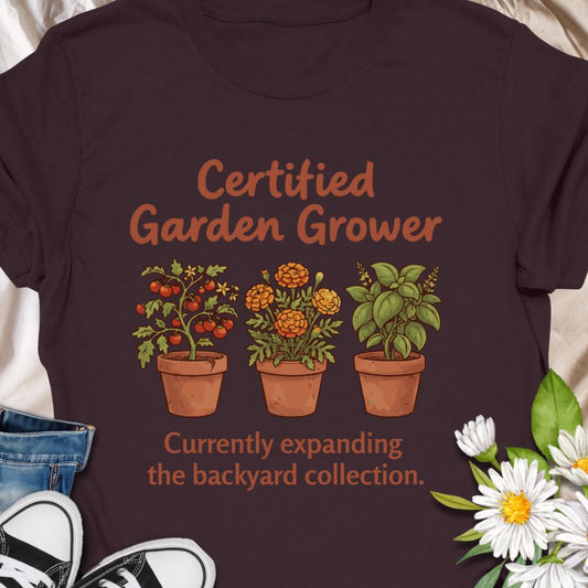 Show off your green thumb with this charming “Certified Garden Grower” t-shirt featuring potted veggies, herbs, and flowers. Perfect for proud backyard gardeners, homesteaders, or anyone always expanding their plant collection. A great gift for plant lovers and veggie growers!