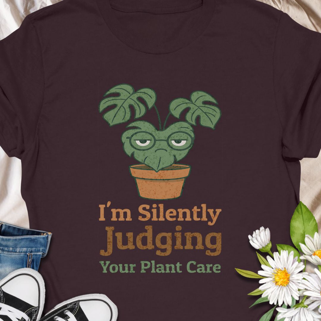 Calling all sassy plant parents – this “I'm Silently Judging Your Plant Care” tee is made for you! Featuring a moody monstera in a pot, it’s perfect for green thumbs who have high standards and a sense of humor. Ideal gift for plant moms, plant dads, and houseplant snobs alike!